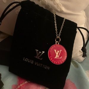 Louis Vuitton zipper pull on a non brand gold tone chain. Pouch included